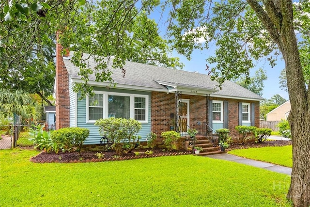 1424 E 53rd St, Savannah, GA 31404 - view of front facade with a chimney and a shingled roof