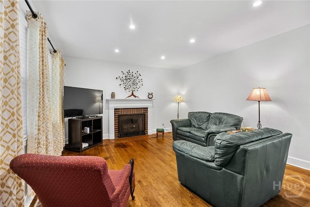 1424 E 53rd St, Savannah, GA 31404 - living room with recessed lighting, wood finished floors, and a brick fireplace