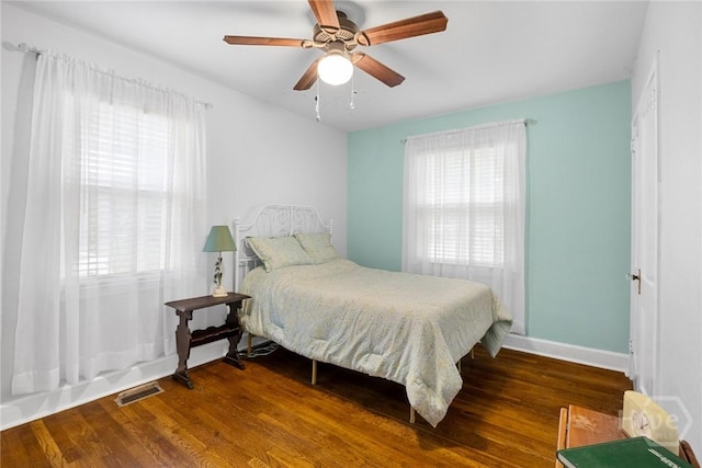 1424 E 53rd St, Savannah, GA 31404 - bedroom with multiple windows, wood finished floors, and a ceiling fan