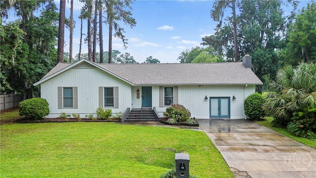 27 Bryan Wood Cir, Savannah, GA 31410 - ranch-style house featuring driveway, a chimney, french doors, roof with shingles, and a front yard