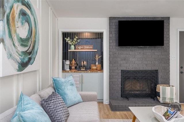 27 Bryan Wood Cir, Savannah, GA 31410 - living room featuring a brick fireplace and wood finished floors