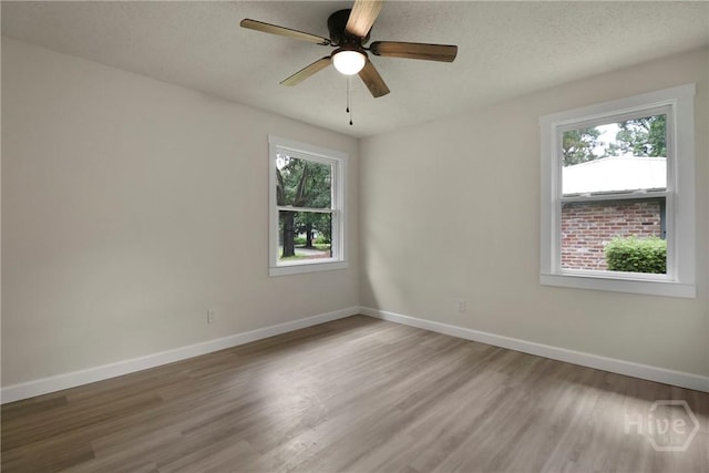114 Paradise Dr, Savannah, GA 31406 - spare room featuring healthy amount of natural light, wood finished floors, and a ceiling fan