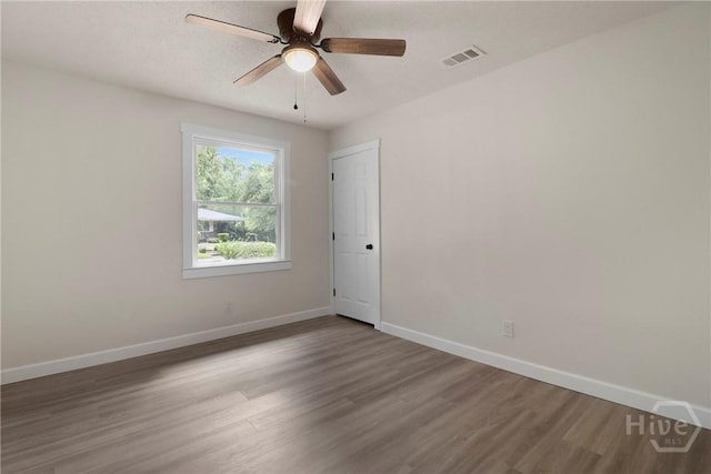114 Paradise Dr, Savannah, GA 31406 - empty room with wood finished floors and ceiling fan