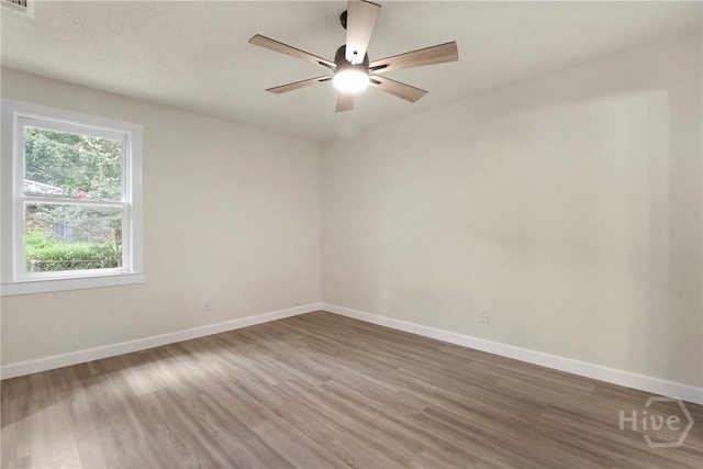 114 Paradise Dr, Savannah, GA 31406 - empty room with wood finished floors and a ceiling fan