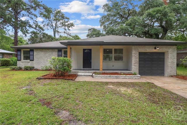 114 Paradise Dr, Savannah, GA 31406 - view of front facade featuring concrete driveway, an attached garage, covered porch, a front yard, and brick siding