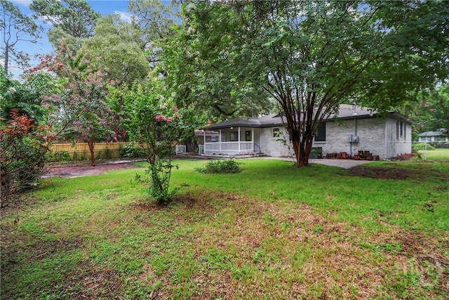 114 Paradise Dr, Savannah, GA 31406 - view of yard featuring a sunroom