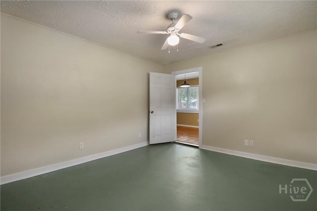 5012 Spartan Dr, Savannah, GA 31404 - unfurnished room with finished concrete floors, a textured ceiling, and ceiling fan