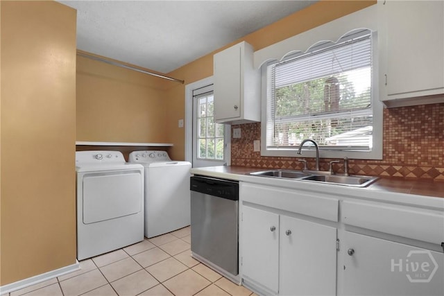 5012 Spartan Dr, Savannah, GA 31404 - washroom with washing machine and clothes dryer and light tile patterned flooring