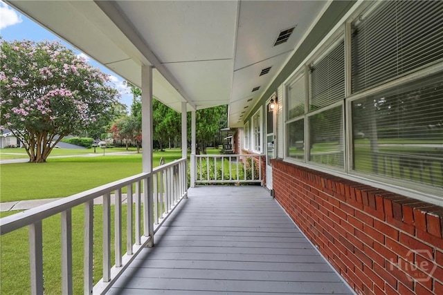 5012 Spartan Dr, Savannah, GA 31404 - wooden porch featuring a yard