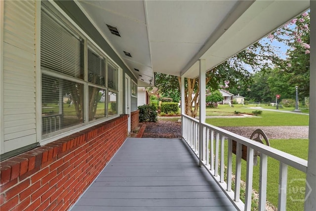 5012 Spartan Dr, Savannah, GA 31404 - wooden porch with a lawn
