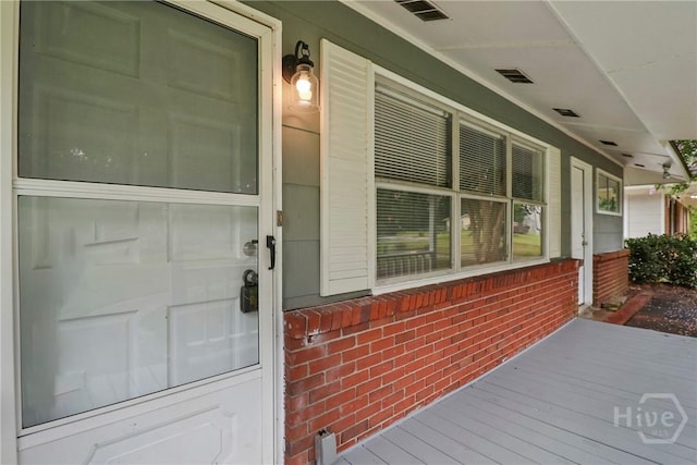 5012 Spartan Dr, Savannah, GA 31404 - doorway to property with covered porch and brick siding