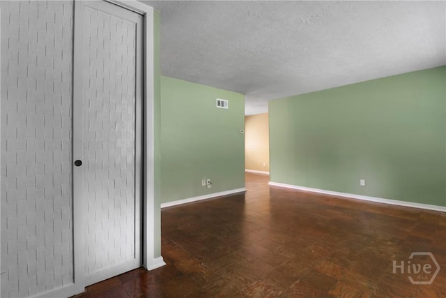 5012 Spartan Dr, Savannah, GA 31404 - unfurnished room featuring baseboards and a textured ceiling