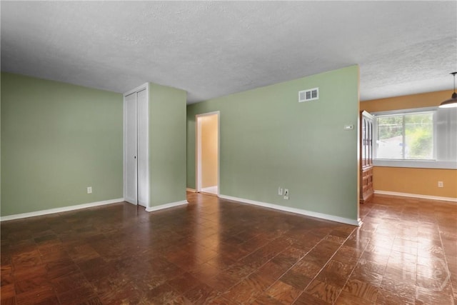 5012 Spartan Dr, Savannah, GA 31404 - unfurnished room with a textured ceiling