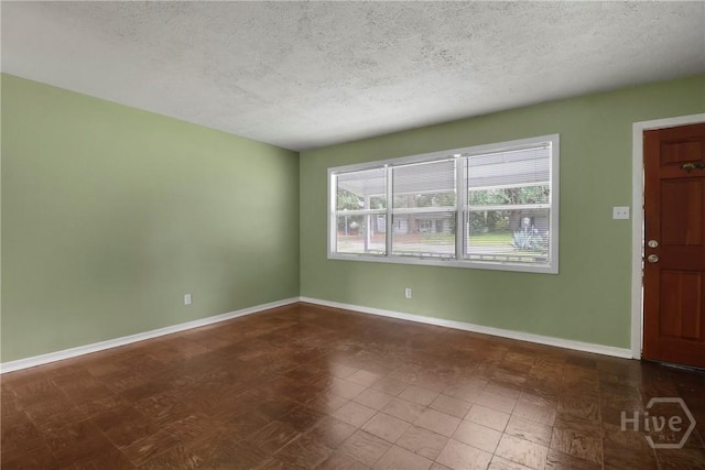 5012 Spartan Dr, Savannah, GA 31404 - unfurnished room featuring a textured ceiling and baseboards