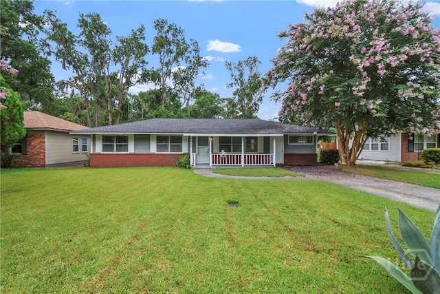 5012 Spartan Dr, Savannah, GA 31404 - ranch-style house featuring driveway, a porch, and brick siding