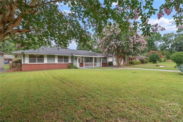 5012 Spartan Dr, Savannah, GA 31404 - view of front facade with brick siding and a porch
