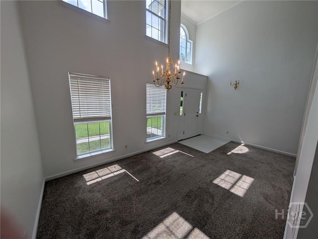 47 Rose Hill Dr, Savannah, GA 31419 - carpeted foyer entrance featuring a chandelier, ornamental molding, and a towering ceiling