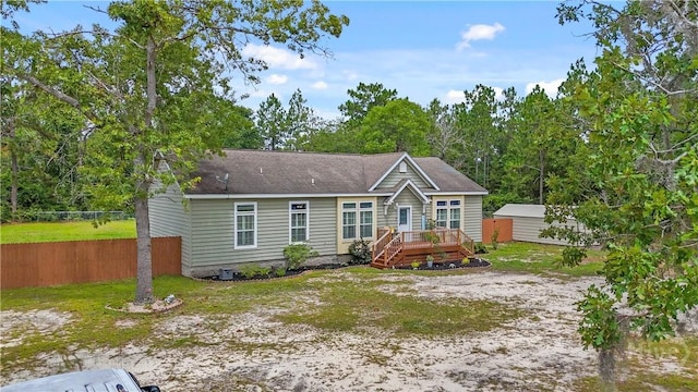 586 Church Cir, Jesup, GA 31545 - view of front of house featuring a wooden deck and a storage unit