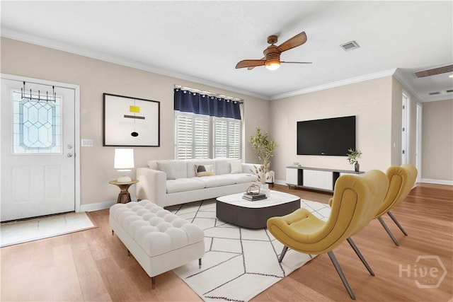 586 Church Cir, Jesup, GA 31545 - living room featuring wood finished floors, a ceiling fan, and crown molding