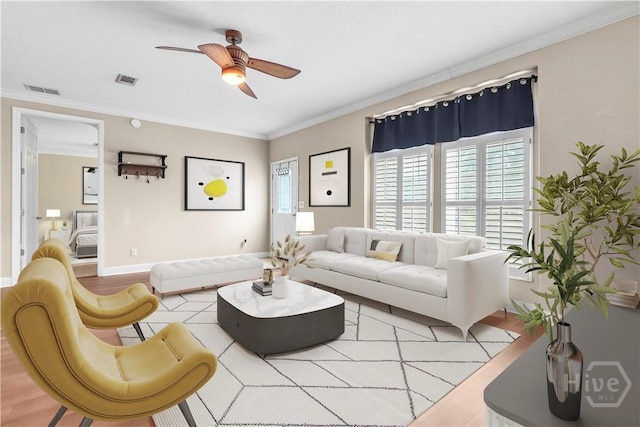 586 Church Cir, Jesup, GA 31545 - living area featuring a ceiling fan, crown molding, and light wood-style floors
