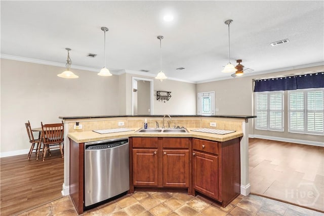 586 Church Cir, Jesup, GA 31545 - kitchen featuring stainless steel dishwasher, a ceiling fan, a center island with sink, decorative light fixtures, and crown molding