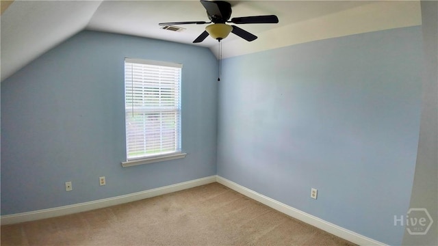 131 Brigham Dr, Richmond Hill, GA 31324 - spare room featuring healthy amount of natural light, lofted ceiling, a ceiling fan, and light colored carpet