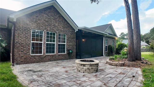 131 Brigham Dr, Richmond Hill, GA 31324 - view of patio with a fire pit