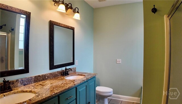 131 Brigham Dr, Richmond Hill, GA 31324 - full bathroom with a shower with door, double vanity, and tile patterned floors