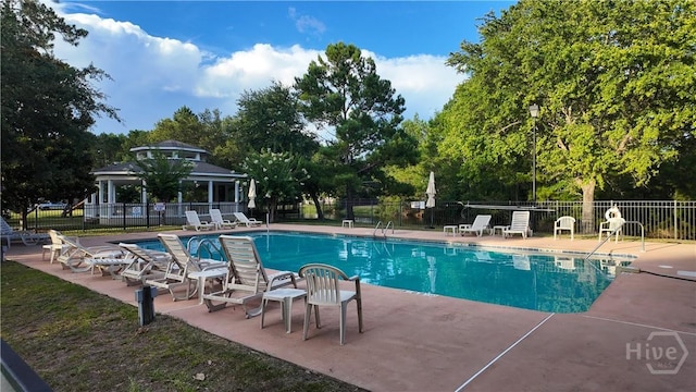 131 Brigham Dr, Richmond Hill, GA 31324 - community pool with a gazebo, a patio, and view of scattered trees