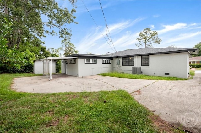 4611 Cumberland Dr, Savannah, GA 31405 - rear view of property with concrete driveway, crawl space, and an attached carport