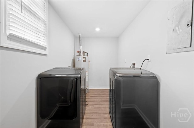 4611 Cumberland Dr, Savannah, GA 31405 - laundry area featuring independent washer and dryer, light wood-style floors, water heater, and recessed lighting