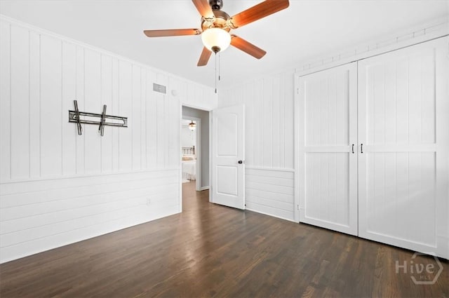 4611 Cumberland Dr, Savannah, GA 31405 - unfurnished bedroom featuring dark wood-type flooring, ceiling fan, and a closet