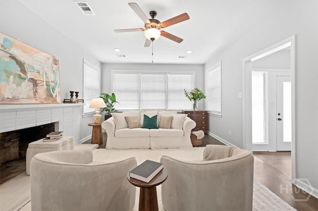 4611 Cumberland Dr, Savannah, GA 31405 - living area with a brick fireplace, a ceiling fan, wood finished floors, and recessed lighting