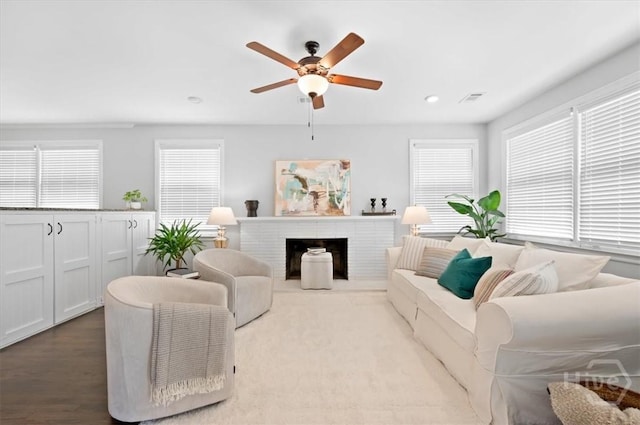 4611 Cumberland Dr, Savannah, GA 31405 - living room featuring healthy amount of natural light, a ceiling fan, a fireplace, and recessed lighting
