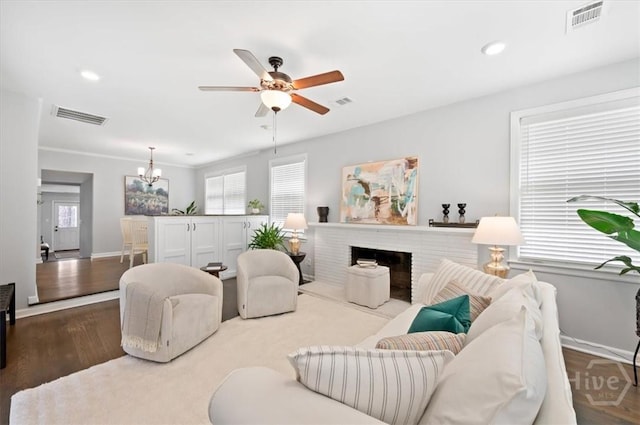 4611 Cumberland Dr, Savannah, GA 31405 - living room with a chandelier, healthy amount of natural light, ceiling fan, dark wood-style flooring, and recessed lighting