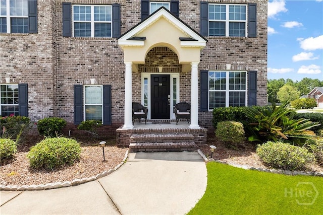 219 Byron Dr, Richmond Hill, GA 31324 - property entrance featuring brick siding