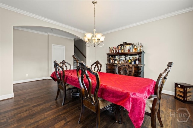 219 Byron Dr, Richmond Hill, GA 31324 - dining space featuring a chandelier, wood finished floors, arched walkways, and ornamental molding