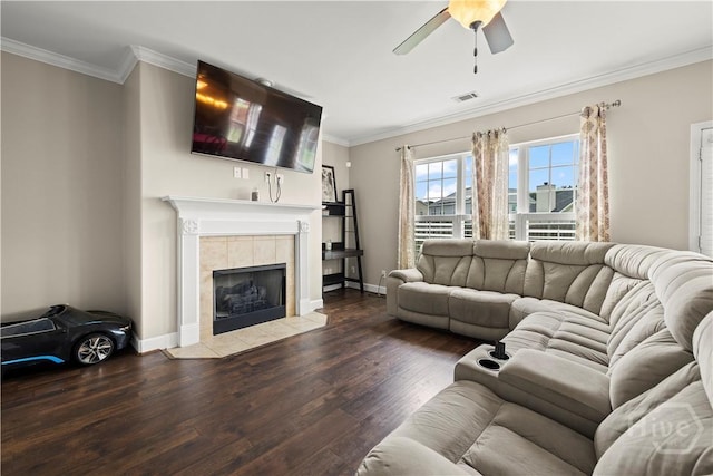 219 Byron Dr, Richmond Hill, GA 31324 - living room with wood finished floors, ceiling fan, a fireplace, and ornamental molding
