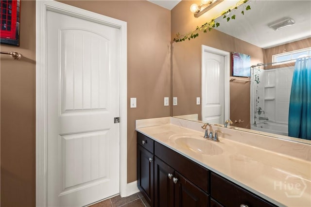 219 Byron Dr, Richmond Hill, GA 31324 - full bathroom with vanity, shower / bath combo with shower curtain, and tile patterned floors