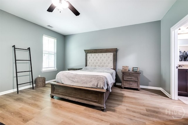 172 Green Paddock Cir, Guyton, GA 31312 - bedroom with light wood-style flooring, ensuite bath, and ceiling fan