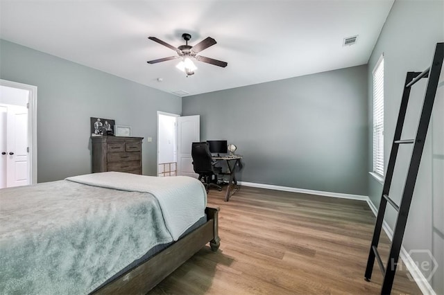 172 Green Paddock Cir, Guyton, GA 31312 - bedroom with wood finished floors, an office area, and ceiling fan