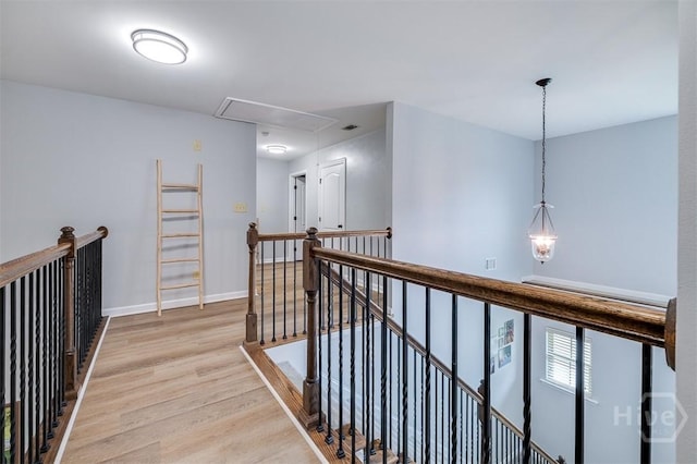 172 Green Paddock Cir, Guyton, GA 31312 - hall featuring attic access, an upstairs landing, and light wood-style flooring
