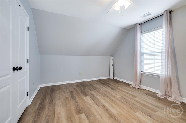 172 Green Paddock Cir, Guyton, GA 31312 - additional living space featuring wood finished floors, vaulted ceiling, and a ceiling fan