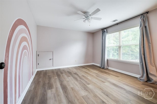 172 Green Paddock Cir, Guyton, GA 31312 - empty room featuring wood finished floors and ceiling fan