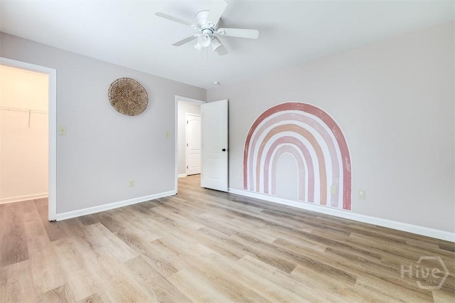 172 Green Paddock Cir, Guyton, GA 31312 - unfurnished bedroom with wood finished floors and ceiling fan