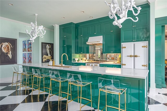 63 Magnolia Ln, Richmond Hill, GA 31324 - kitchen with a chandelier, green cabinets, premium range hood, and crown molding