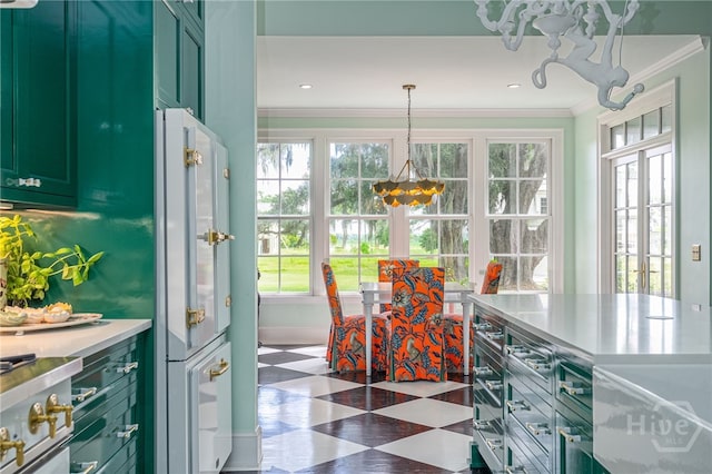 63 Magnolia Ln, Richmond Hill, GA 31324 - dining area with a chandelier, healthy amount of natural light, tile patterned floors, and ornamental molding