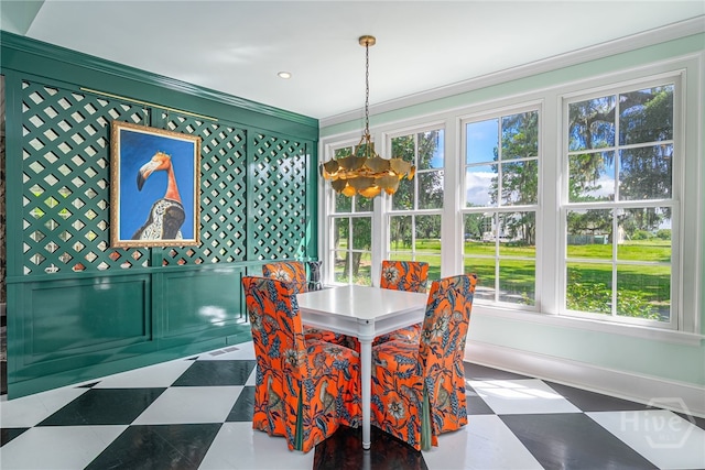 63 Magnolia Ln, Richmond Hill, GA 31324 - dining room with a chandelier, ornamental molding, and a decorative wall