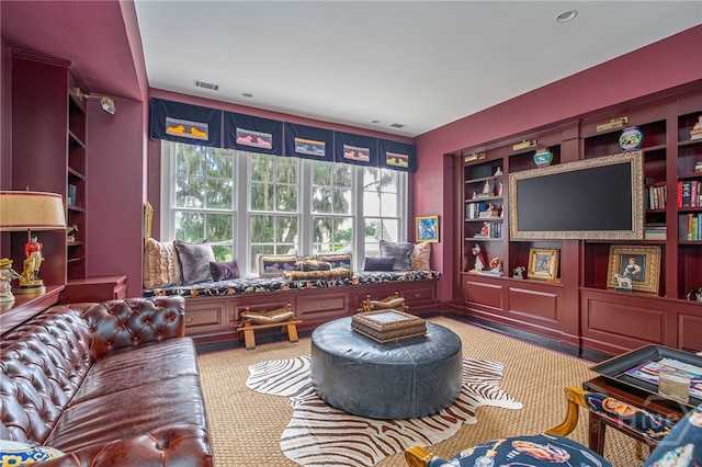 63 Magnolia Ln, Richmond Hill, GA 31324 - living room featuring carpet floors and built in features