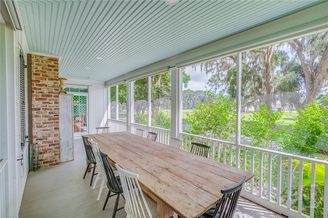 63 Magnolia Ln, Richmond Hill, GA 31324 - sunroom / solarium featuring outdoor dining space